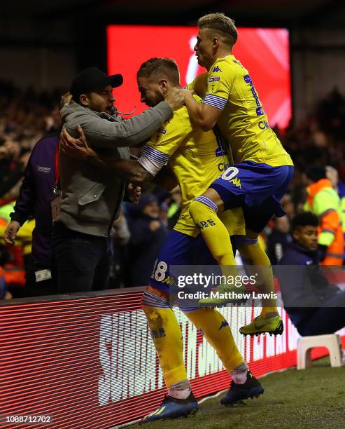 Ezgjan Alioski of Leeds United celebrates scoring his teams second goal with fellow tem mates during the Sky Bet Championship match between...