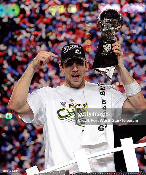 Green Bay Packers quarterback Aaron Rodgers hoists the Lombardi Trophy at the end of Super Bowl XLV where the Green Bay Packers beat the Pittsburgh...