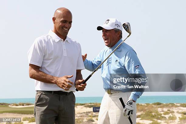 Kelly Slater and Academy Member Gary Player in action during the Laureus Golf Challenge at the Saadiyat Beach Golf Club part of the 2011 Laureus...