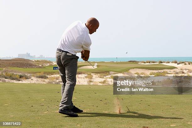 Kelly Slater in action during the Laureus Golf Challenge at the Saadiyat Beach Golf Club part of the 2011 Laureus World Sports Awards on February 6,...
