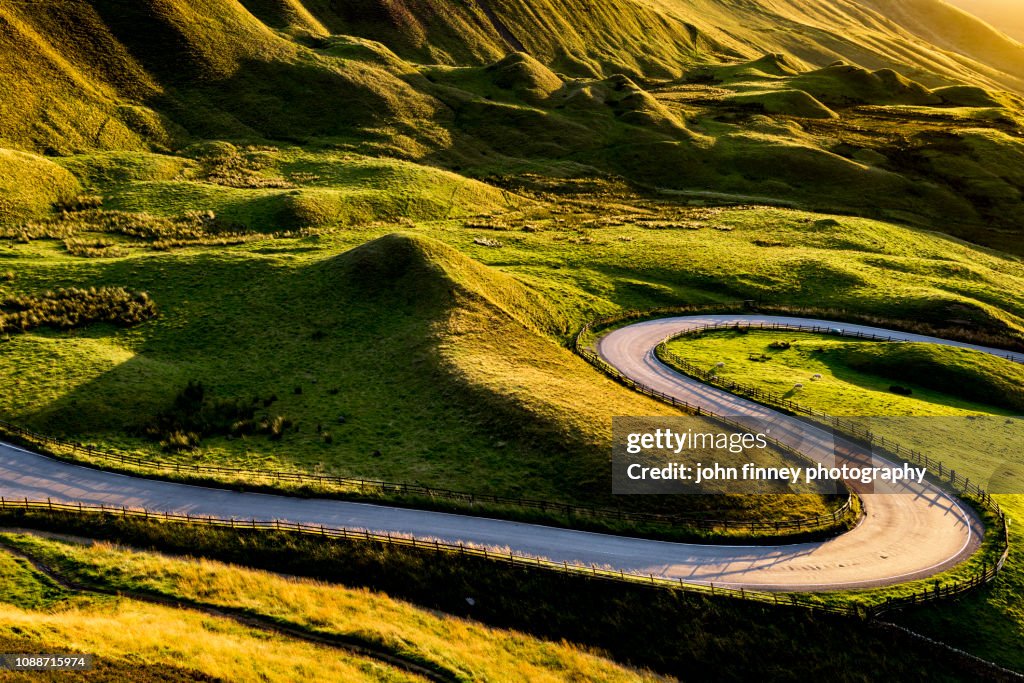 Edale valley twisty road at sunset. English Peak District. UK