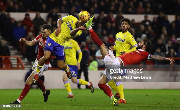 Kemar Roofe of Leeds United and Danny Fox of Nottingham Forest challenge for the ball during the Sky Bet Championship match between Nottingham Forest...