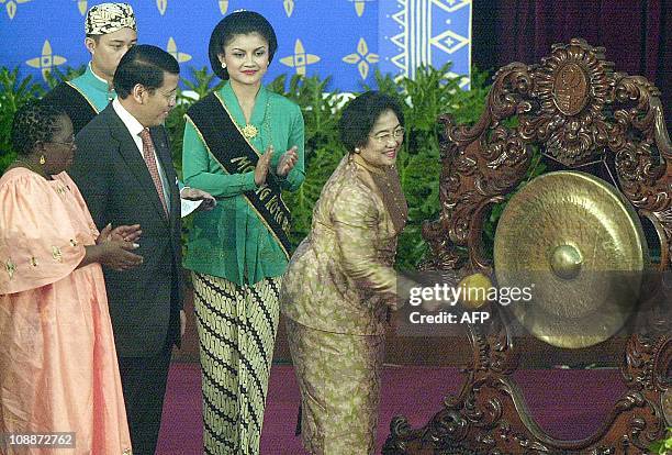 Indonesian President Megawati Sukarnoputri bangs a gong to mark the opening ceremony of Asian African Sub Regional Organisation Conference in...