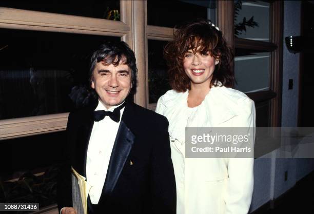 Dudley Moore with one of his four wives Brogan Lane arriving October 14, 1990 at the British Consulate, Los Angeles, California