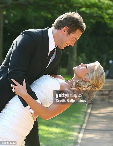 South African rugby player Andrew David "Butch" James poses with his bride Julia Westbrook during their wedding at Lynton Hall on 5 February 2011 in...