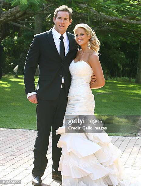 South African rugby player Andrew David "Butch" James poses with his bride Julia Westbrook during their wedding at Lynton Hall on 5 February 2011 in...