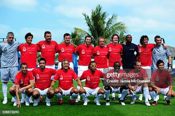 The teams pose before the Laureus Football Challenge presented by IWC Schaffhausen as part of the 2011 Laureus World Sports Awards at the Emirates...
