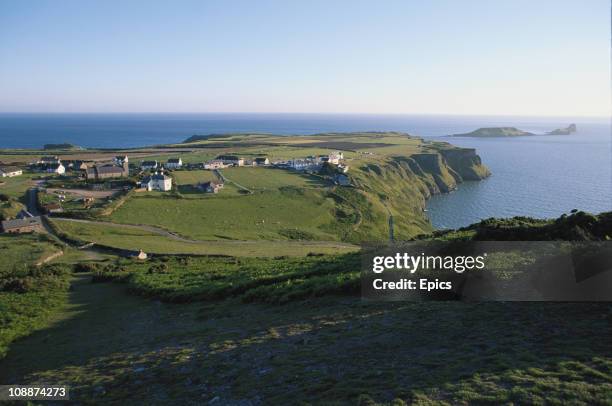 Scenic view of the coast and Rhossili village Gower Peninsula, Wales, June 1997.