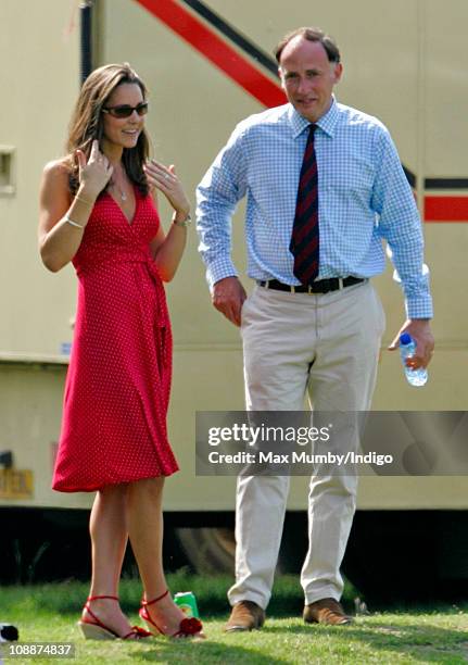 Kate Middleton and Prince William's Private Secretary Jamie Lowther-Pinkerton watch Prince William compete in the Chakravarty Cup charity polo match...