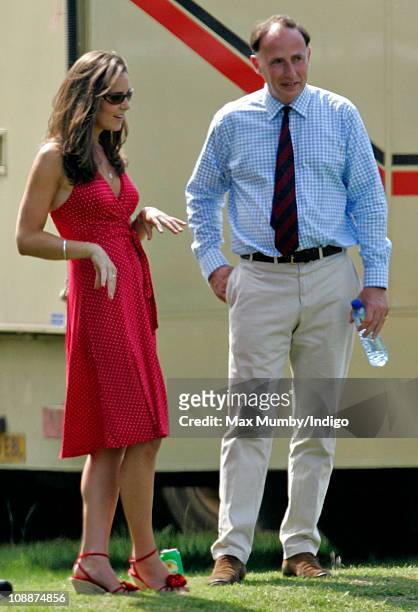 Kate Middleton and Prince William's Private Secretary Jamie Lowther-Pinkerton watch Prince William compete in the Chakravarty Cup charity polo match...
