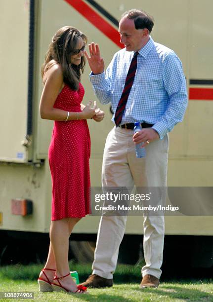 Kate Middleton and Prince William's Private Secretary Jamie Lowther-Pinkerton watch Prince William compete in the Chakravarty Cup charity polo match...