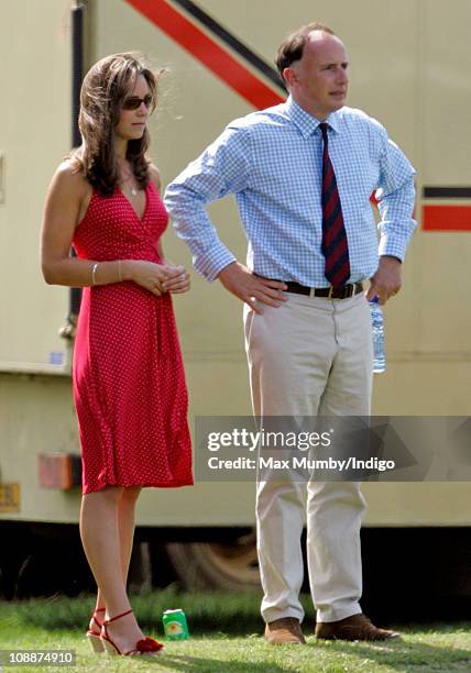 Kate Middleton and Prince William's Private Secretary Jamie Lowther-Pinkerton watch Prince William compete in the Chakravarty Cup charity polo match...