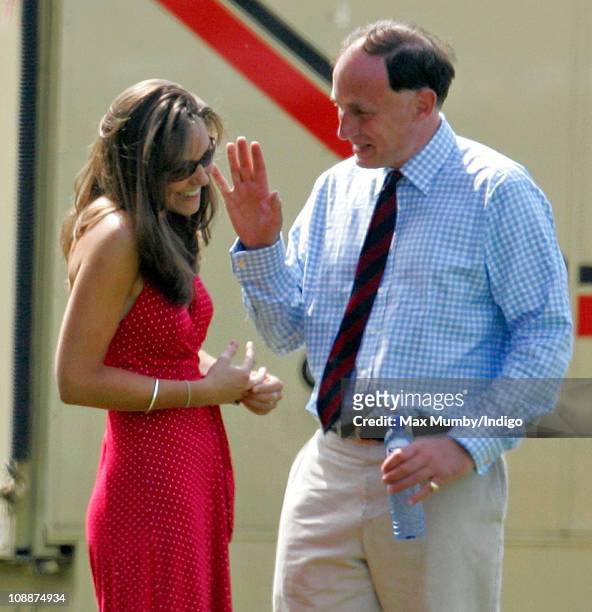Kate Middleton and Prince William's Private Secretary Jamie Lowther-Pinkerton watch Prince William compete in the Chakravarty Cup charity polo match...