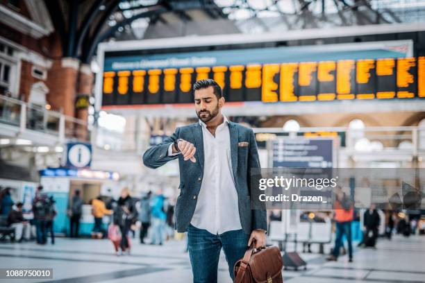 millennial indian businessman traveling for work - indian arrival stock pictures, royalty-free photos & images