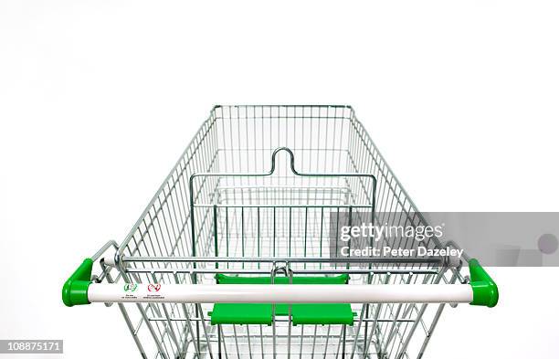 supermarket trolley on white background - grocery cart stock-fotos und bilder