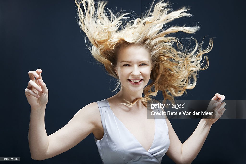 Woman dancing in wind.