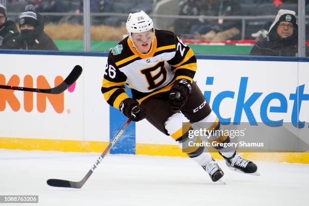 Colby Cave of the Boston Bruins skates in the second period against the Chicago Blackhawks during the 2019 Bridgestone NHL Winter Classic at Notre...