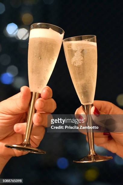 people toasting with glass of champagne on new year's eve - two year anniversary party ストックフォトと画像