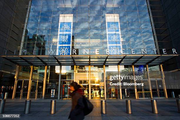 Pedestrian walks past the Time Warner Center, headquarters building of Time Warner Inc., in New York, U.S., on Monday, Feb. 7, 2011. AOL Inc. Agreed...