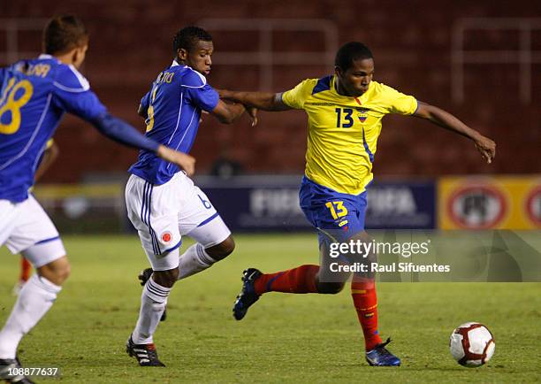 Edson Montano , Ecuador player eludes mark Didier Moreno , player of Colombia, during the match between national teams of Colombia and Ecuador as...