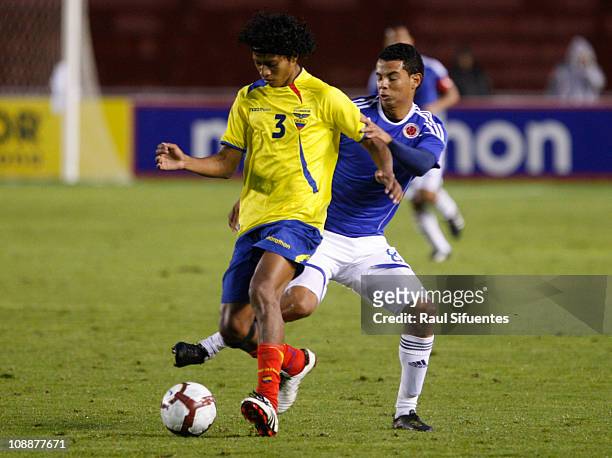Jhon Narvaez , player of Ecuador, anticipates Edwin Carmona , player of Colombia, during the match between national teams of Colombia and Ecuador as...
