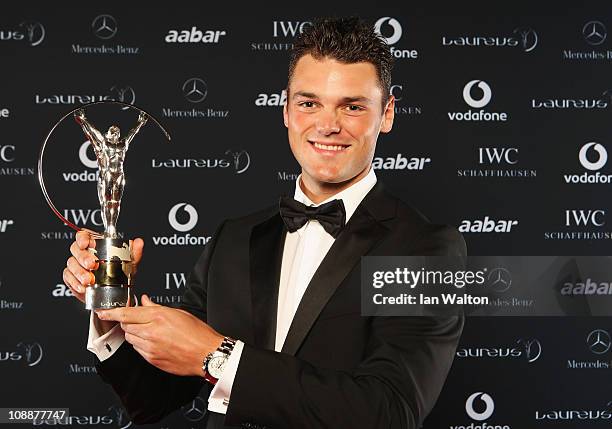 Golfer Martin Kaymer of Germany poses with his award for Laureus World Breakthrough of the Year in the winners studio at the 2011 Laureus World...