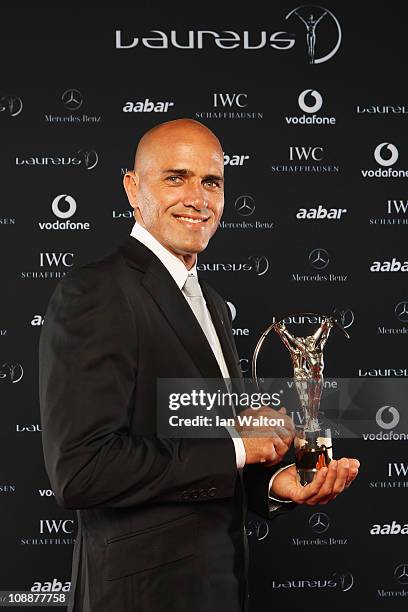 Surfer Kelly Slater of the United States poses with his award for Laureus World Action Sportsperson of the Year in the winners studio at the 2011...