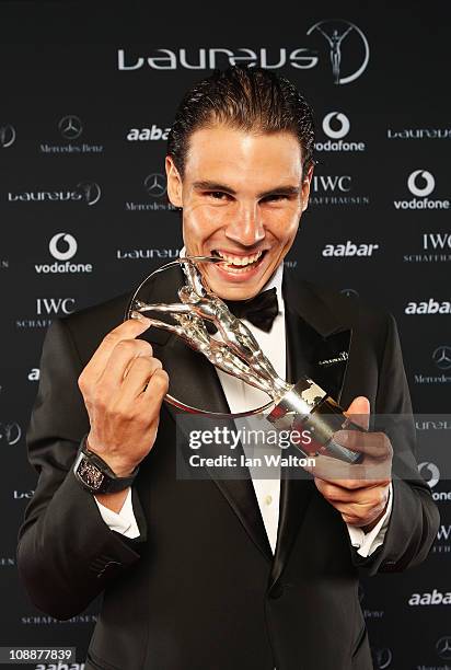 Tennis Player Rafael Nadal of Spain poses with his award for Laureus World Sportsman of the Year in the winners studio at the 2011 Laureus World...