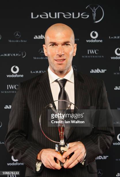 Zinedine Zidane poses with his award for Laureus Lifetime Achievement Award in the winners studio at the 2011 Laureus World Sports Awards at the...