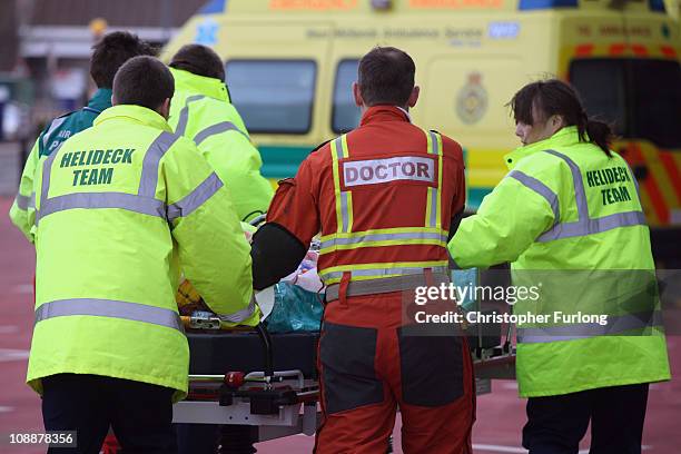 An emergency team from the West Midlands Air Ambulance deliver a serious injured patient to the Accident and Emergency department at the recently...