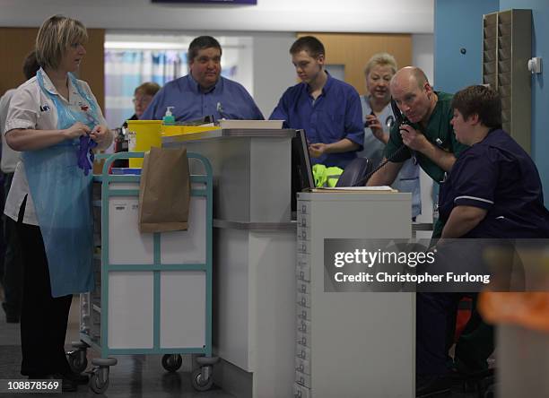 Staff work in the busy Accident and Emergency department of the recently opened Birmingham Queen Elizabeth Hospital attends a work station on...