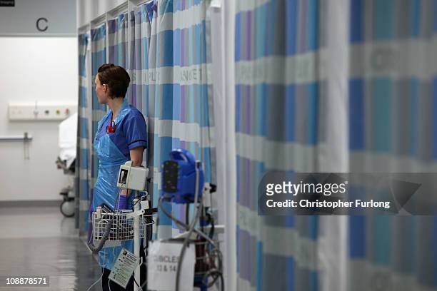Nurse works in the busy Accident and Emergency department of the recently opened Birmingham Queen Elizabeth Hospital attends a work station on...