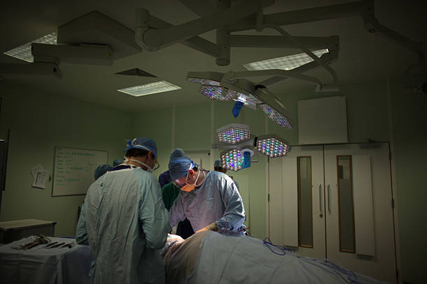 Surgeon performs a neck and throat operation in the recently opened Birmingham Queen Elizabeth Hospital on February 7, 2011 in Birmingham, England....