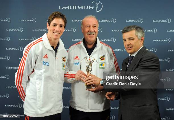 Head coach of the Spanish team Vicente del Bosque and player Fernando Torres receive the Laureus Team award from the president of Laureus Foundation...