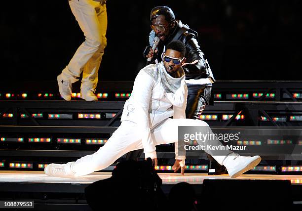 Usher performs with will.i.am of The Black Eyed Peas during the Bridgestone Super Bowl XLV Halftime Show at Dallas Cowboys Stadium on February 6,...