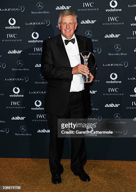 Colin Montgomerie poses with the award for Laureus Spirit Of Sport Award to the European Ryder Cup team in the winners studio at the 2011 Laureus...