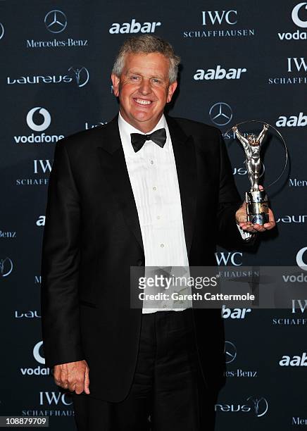 Colin Montgomerie poses with the award for Laureus Spirit Of Sport Award to the European Ryder Cup team in the winners studio at the 2011 Laureus...