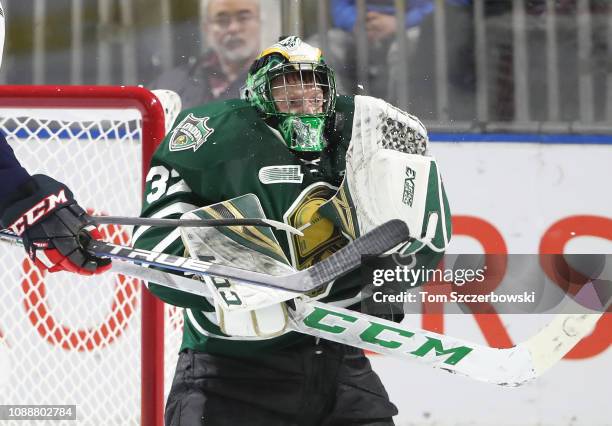 Joseph Raaymakers of the London Knights makes a save as he bobbles the puck in the third period during OHL game action against the Windsor Spitfires...