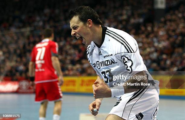 Dominik Klein of Kiel celebrates after scoring during the Toyota Handball Bundesliga match between THW Kiel and HSG Ahlen at the Sparkassen Arena on...