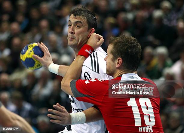 Momir Ilic of Kiel is challenged by Jiri Hynek of Ahlen during the Toyota Handball Bundesliga match between THW Kiel and HSG Ahlen at the Sparkassen...
