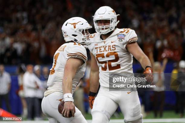 Sam Ehlinger of the Texas Longhorns reacts after scoring a touchdown against the Georgia Bulldogs at the Mercedes-Benz Superdome on January 01, 2019...