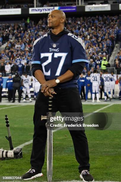 Eddie George, former member of the Tennessee Titans holds a sword for the 12th Titan prior to a game against the Indianapolis Colts at Nissan Stadium...