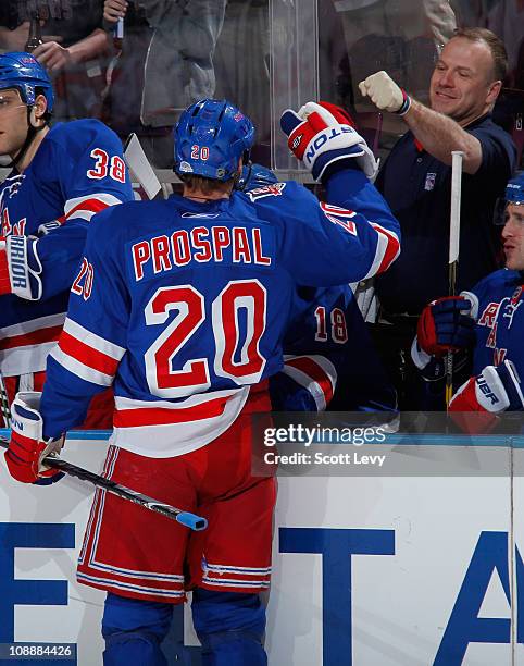 Vinny Prospal of the New York Rangers gets a fist-pump from his trainer during the game against the New Jersey Devils on February 3, 2011 at Madison...