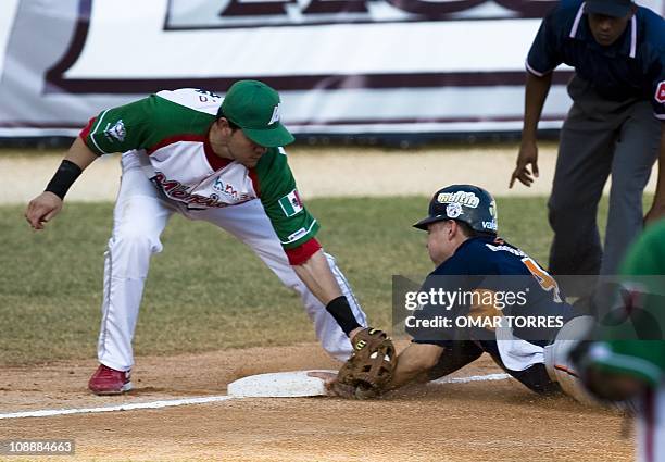 Mexican third base Agustin Murillo puts out Venezuelan Niuman Romero during the fifth inning of their Caribbean Baseball Series game at the Isidoro...