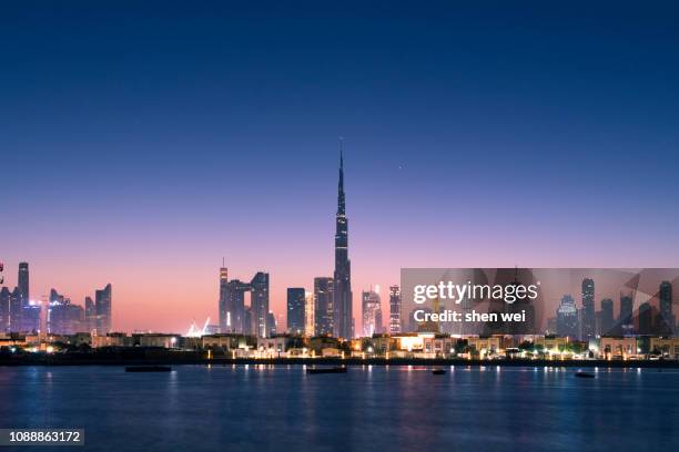 beautiful skyline view of dubai , uae - skyline dusk stock pictures, royalty-free photos & images