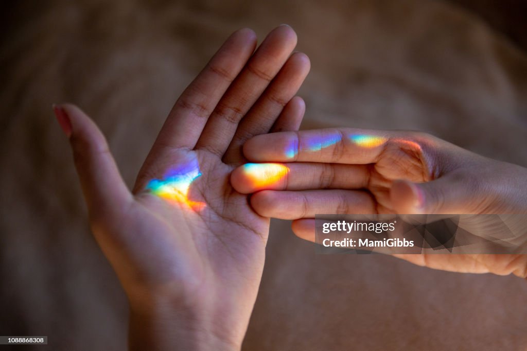 Hand Reflection Activity Reflection Of The Rainbow On The Hands High-Res Stock Photo - Getty Images