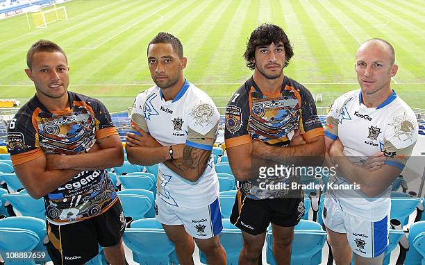 Scott Prince, Benji Marshall, Johnathan Thurston and Darren Lockyer pose for a photo during an NRL All-Stars media conference at Skilled Park on...
