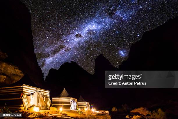 tourist tents in wadi rum dessert at night. jordan. - arabian desert adventure night photos et images de collection