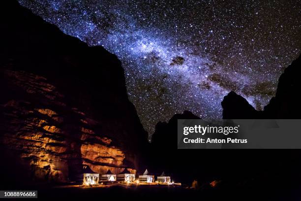 tourist tents in wadi rum dessert at night. jordan. - arabian desert adventure night photos et images de collection