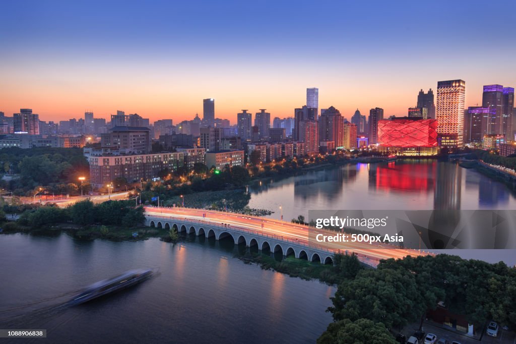 City skyline with Han Show Theatre at dusk, Wuhan, Hubei, China